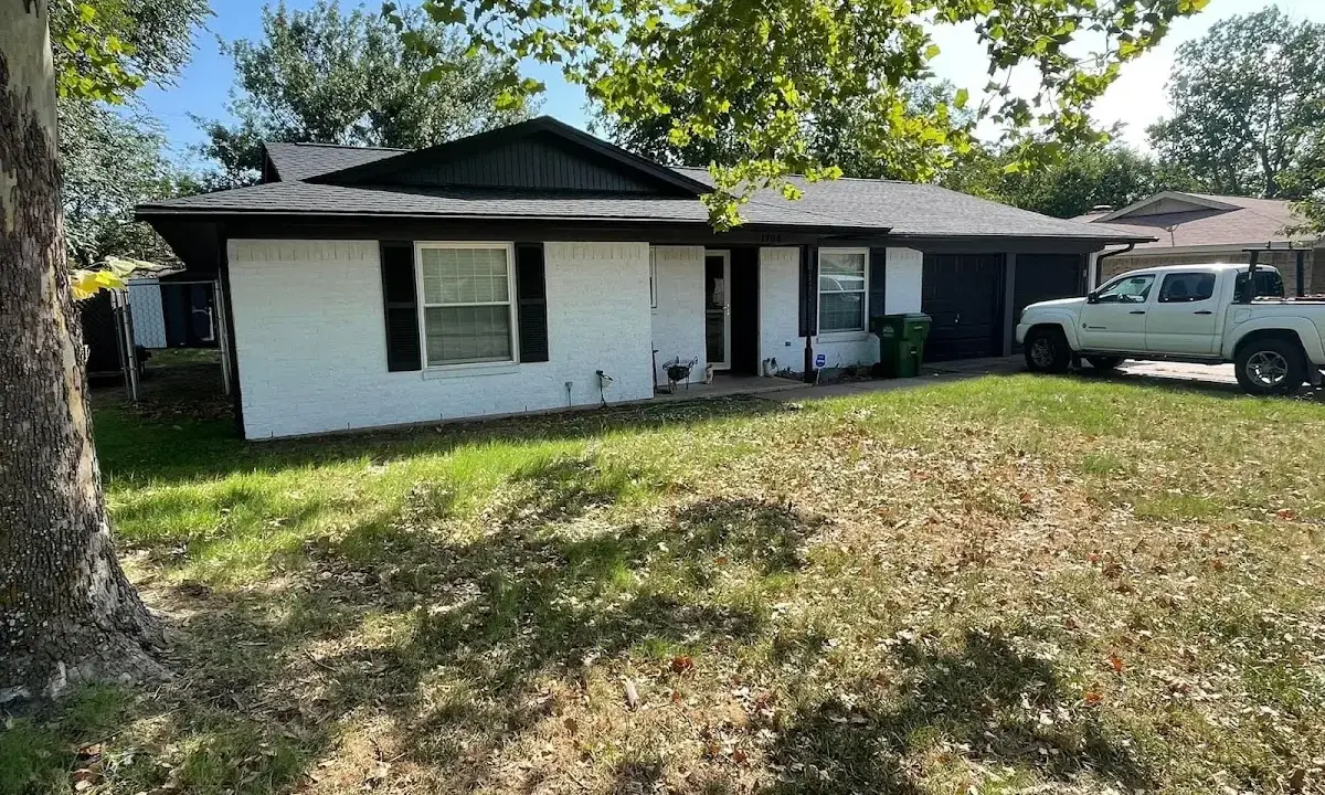 Professional roofing crew working on a residential roof in Limerick